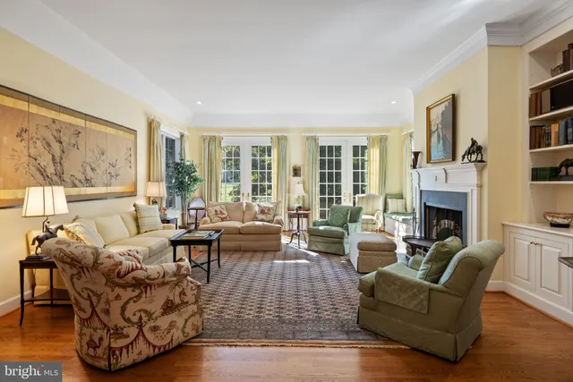 a living room with furniture a window and a table