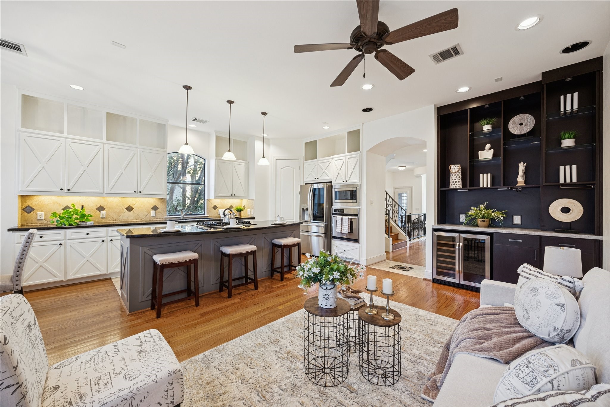 4226 Law Street, Unit B Houston, TX 77005 - Photo 11 of 32 a living room with furniture a rug and kitchen view