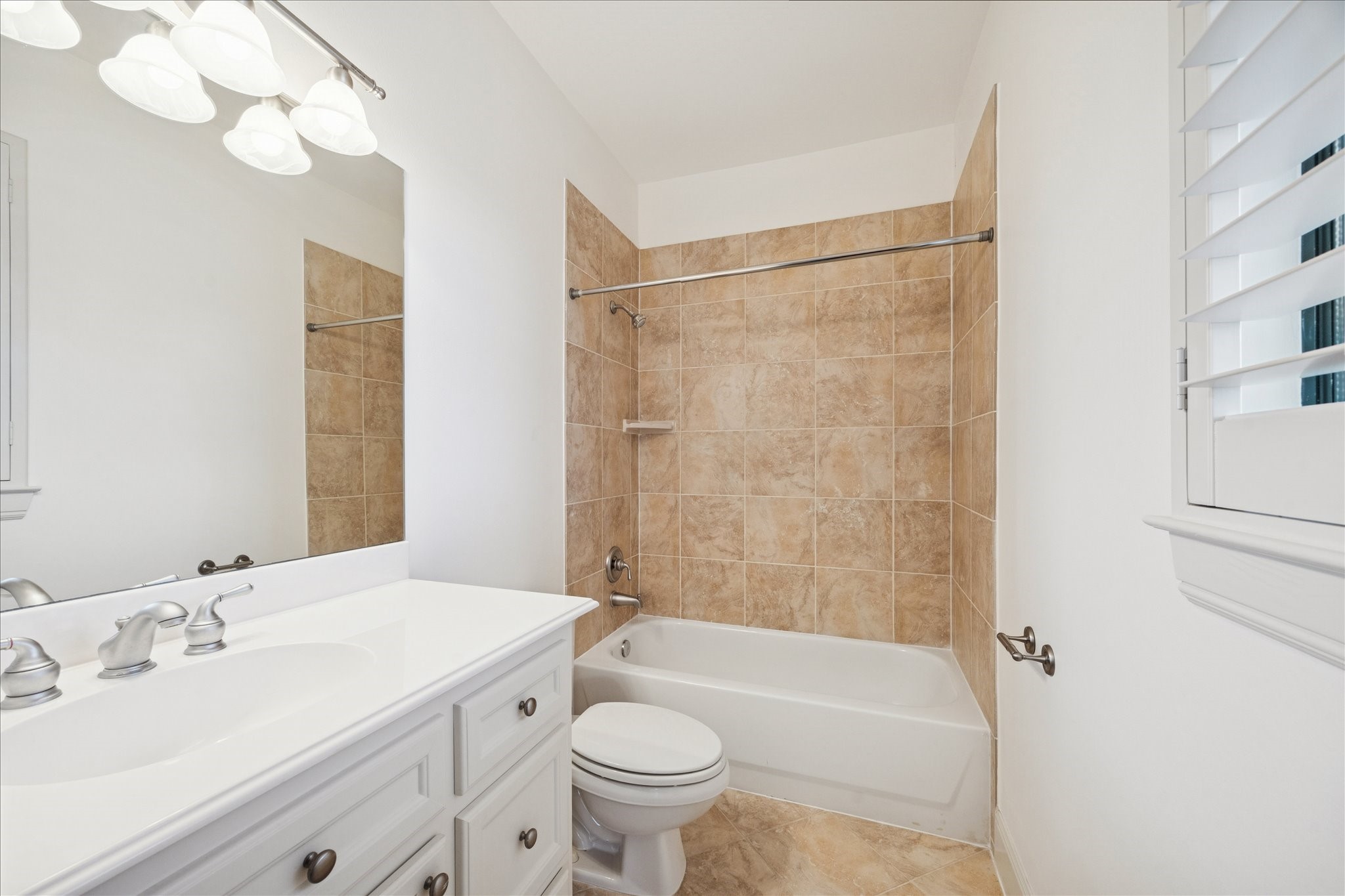4226 Law Street, Unit B Houston, TX 77005 - Photo 26 of 32 a bathroom with a sink a toilet and a bathtub