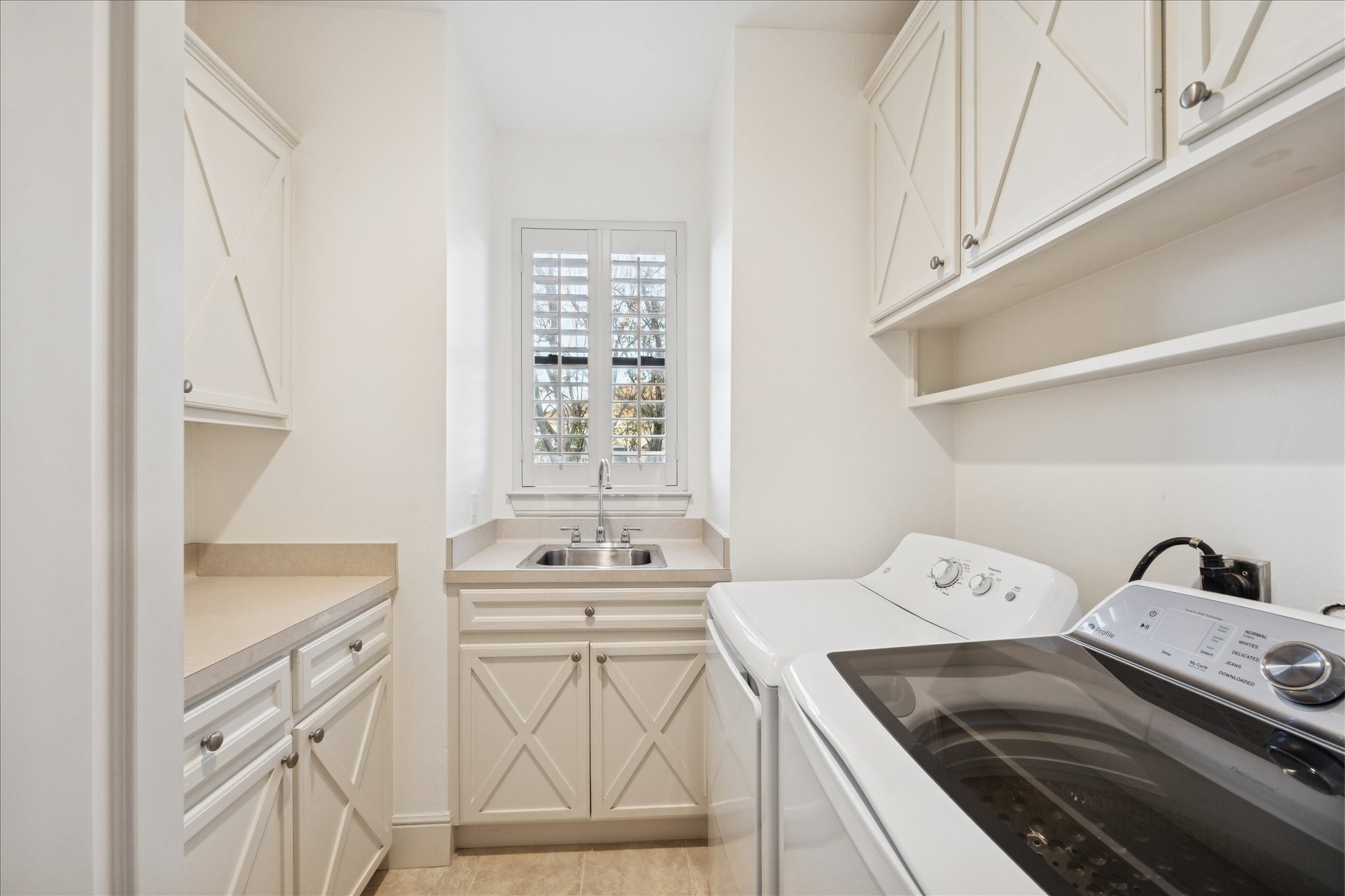 4226 Law Street, Unit B Houston, TX 77005 - Photo 27 of 32 a utility room with dryer washer and a view of living room