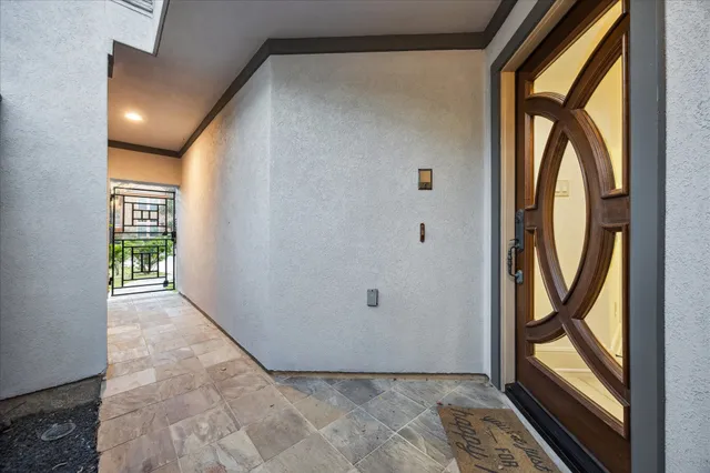 a view of hallway with a large window and painted walls
