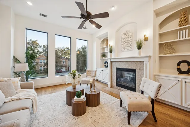 a living room with furniture and a fireplace