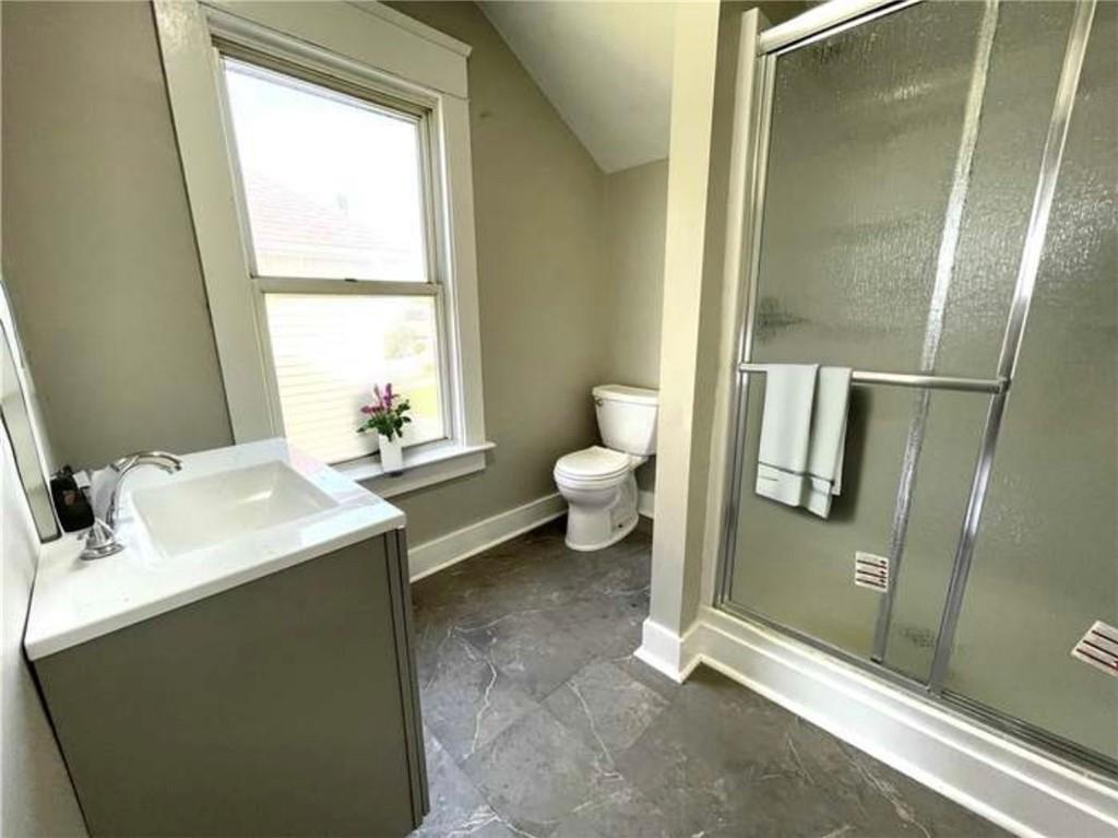 1049 Adams Street New Castle, PA 16101 - Photo 10 of 10 a bathroom with a sink toilet and shower