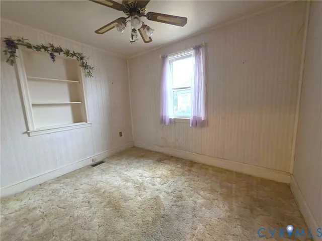 a view of an empty room with a window