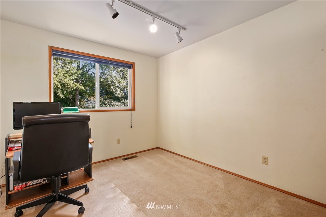 5030 Northeast 21st Street Renton, WA 98059 - Photo 15 of 27 a view of a workspace with furniture and a window