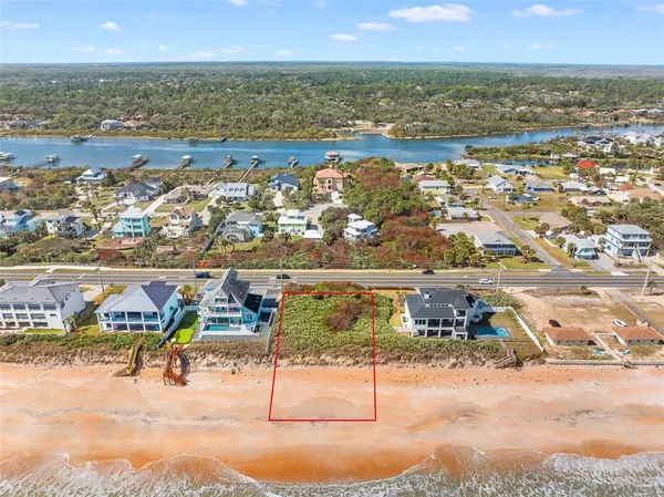 an aerial view of beach and ocean
