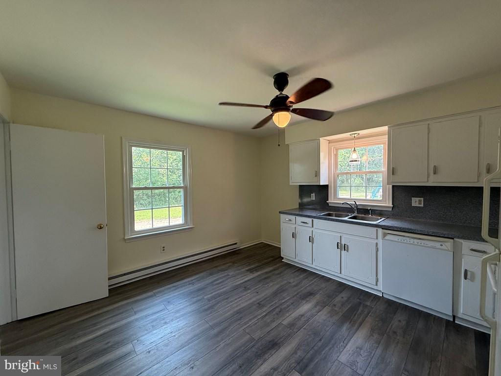 4282 Mary Ball Road Lancaster, VA 22503 - Photo 6 of 18 a large kitchen with cabinets wooden floor and a window