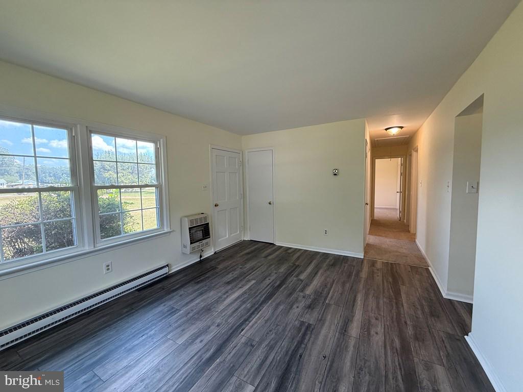 4282 Mary Ball Road Lancaster, VA 22503 - Photo 9 of 18 wooden floor in an empty room with a window