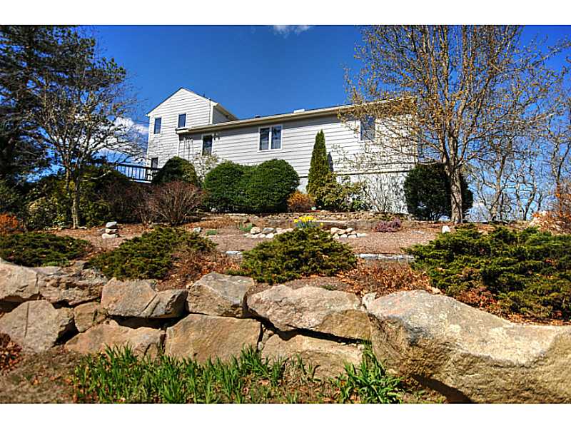 27 Kickapoo Run Charlestown, RI 02813 - Photo 3 of 20 Exterior Front. Mature plantings and natural rock formations enhance the beauty of the surrounding landscape.