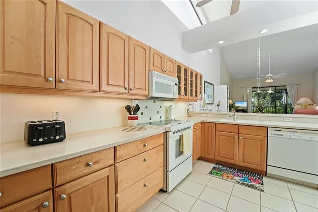 a spacious bathroom with a double vanity sink mirror and shower