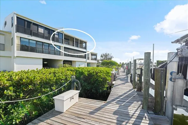an aerial view of a house with a lake view