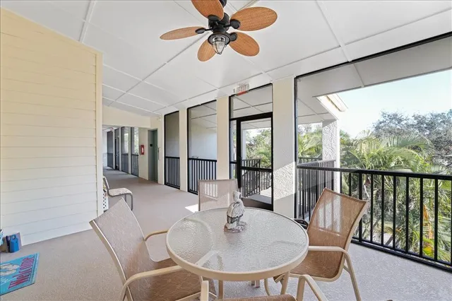 a large white kitchen with a sink and cabinets