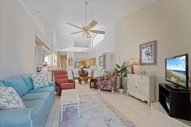 a kitchen with stainless steel appliances a stove a sink dishwasher and a refrigerator with wooden floor