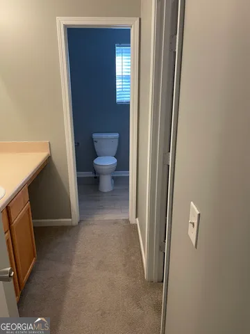 a view of a bathroom with a toilet