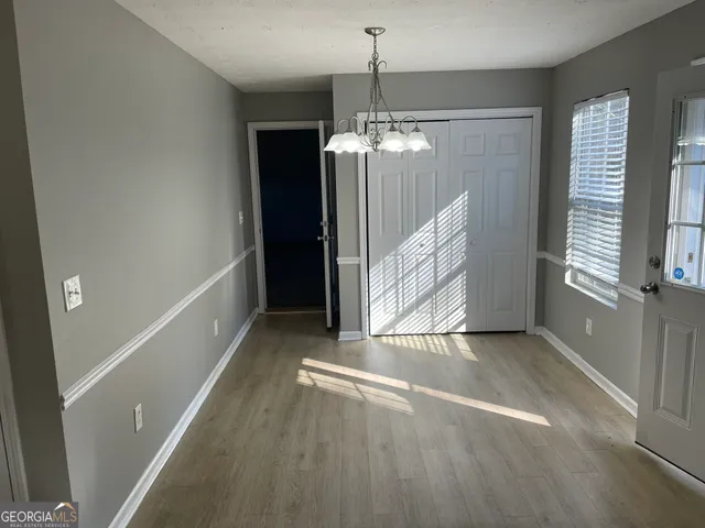a view of a windows and chandelier in a room