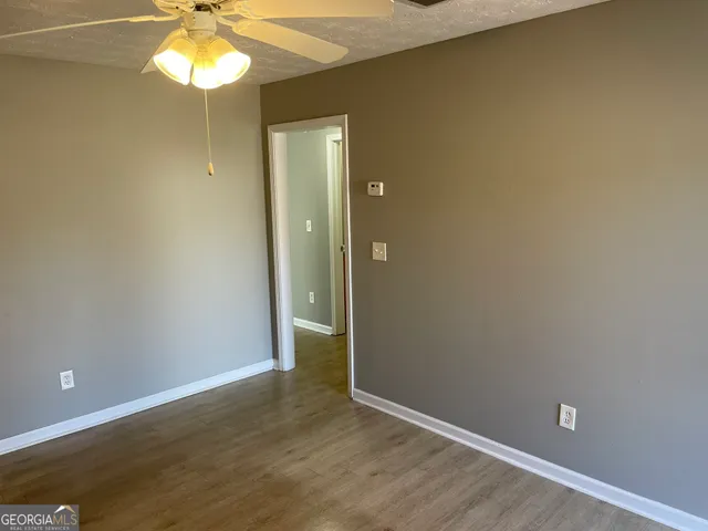 an empty room with a empty space and a window