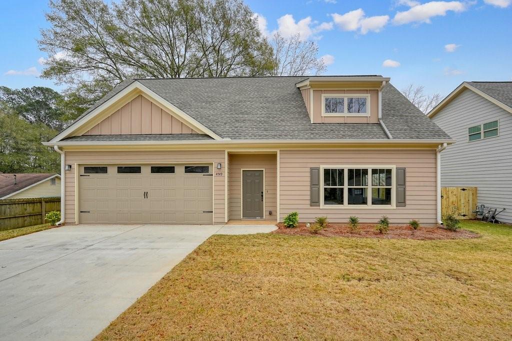 front view of a house with a yard