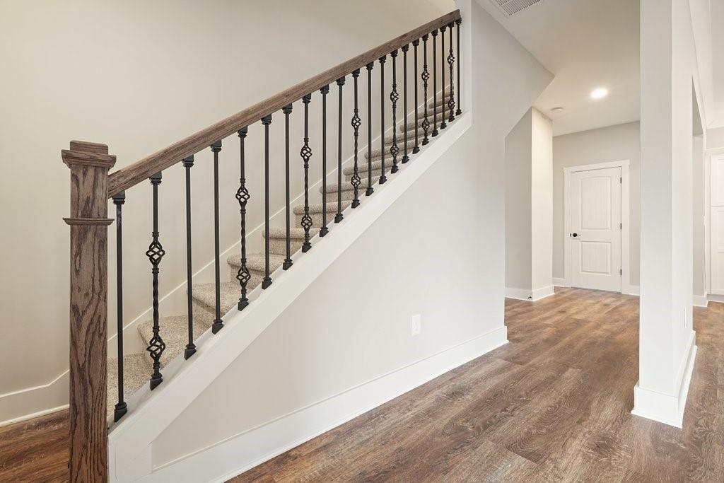 4749 Fowler Street Acworth, GA 30101 - Photo 14 of 60 a view of staircase with railing and white walls