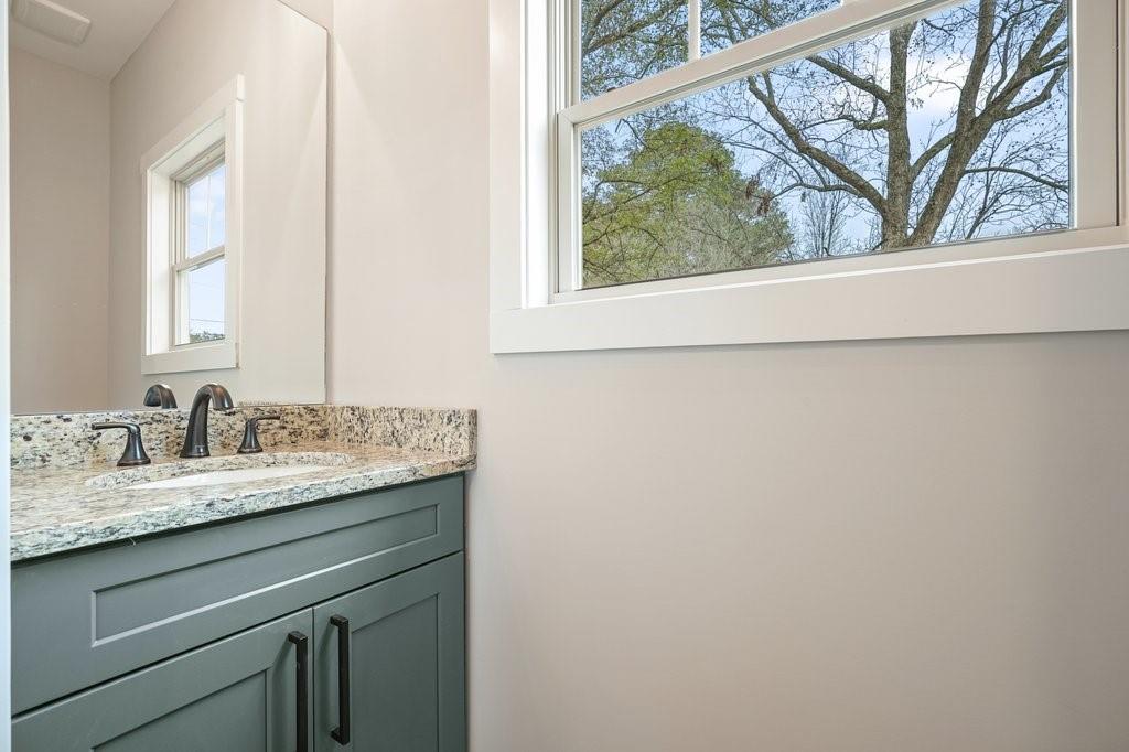 4749 Fowler Street Acworth, GA 30101 - Photo 18 of 60 a bathroom with a granite countertop sink and a window