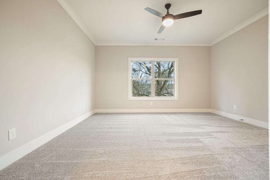 4749 Fowler Street Acworth, GA 30101 - Photo 21 of 60 an empty room with windows and fan