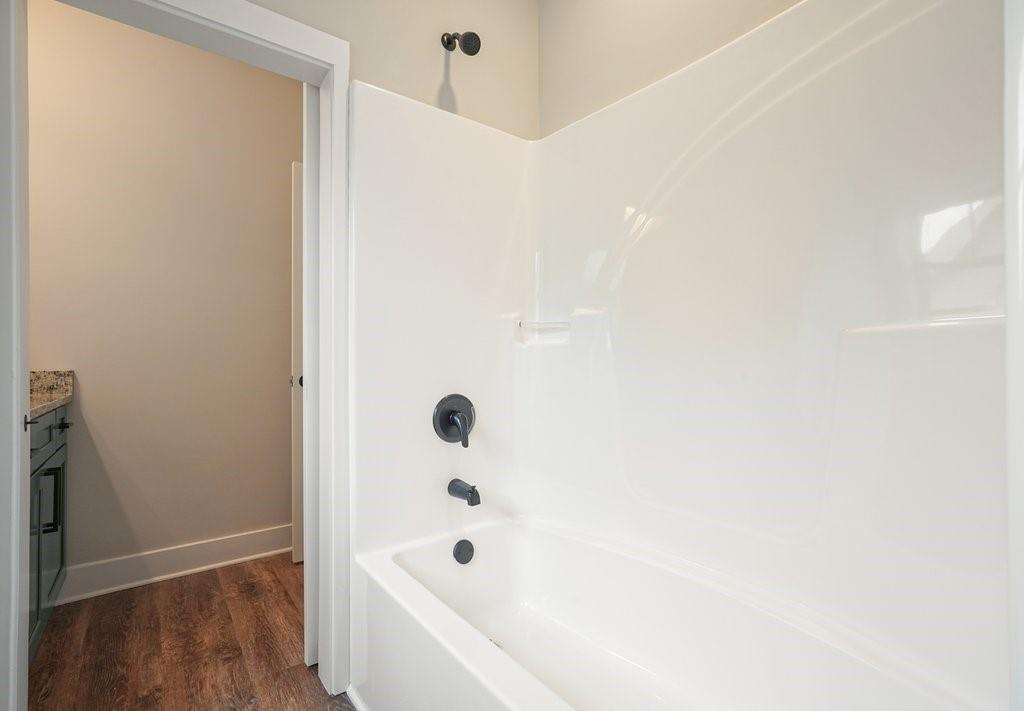 4749 Fowler Street Acworth, GA 30101 - Photo 39 of 60 a bathroom with a bathtub