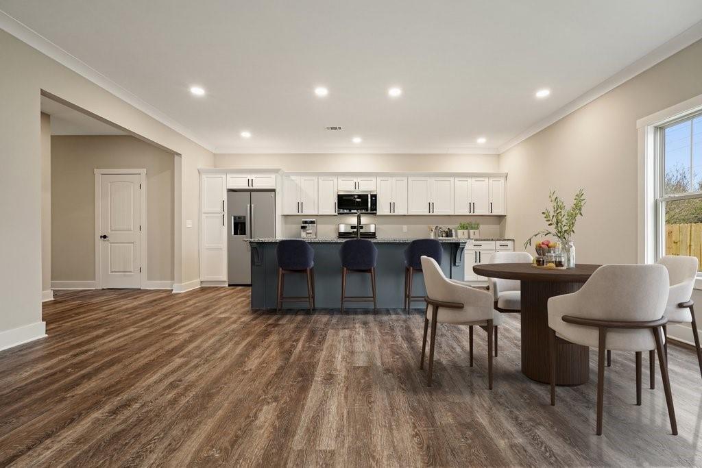 4749 Fowler Street Acworth, GA 30101 - Photo 55 of 60 a living room with stainless steel appliances granite countertop furniture wooden floor a rug and a window