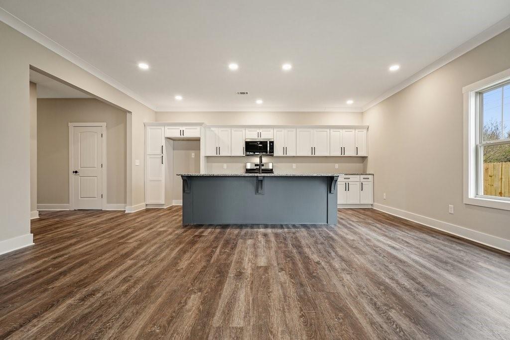 4749 Fowler Street Acworth, GA 30101 - Photo 6 of 60 a view of kitchen with wooden floor and electronic appliances