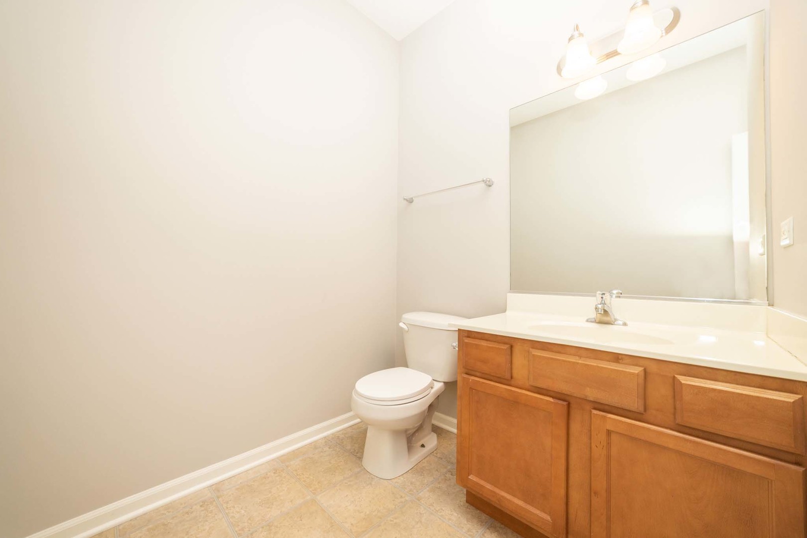 4313 Timber Ridge Court Joliet, IL 60431 - Photo 17 of 25 a bathroom with a sink a toilet and a mirror