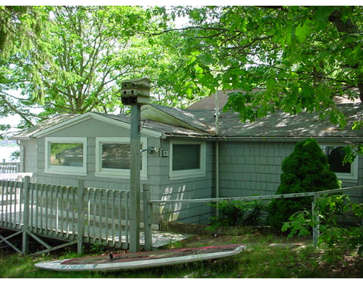 5 F Hideaway Road Bourne, MA 02532 - Photo 1 of 5 a front view of a house with a garden