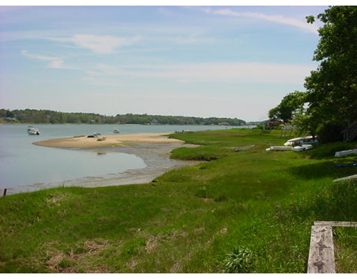 5 F Hideaway Road Bourne, MA 02532 - Photo 2 of 5 a view of a lake with a city