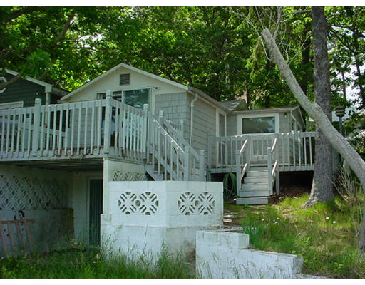 5 F Hideaway Road Bourne, MA 02532 - Photo 4 of 5 a view of front of house with a yard