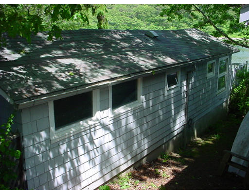 5 F Hideaway Road Bourne, MA 02532 - Photo 5 of 5 a backyard of a house with lots of green space
