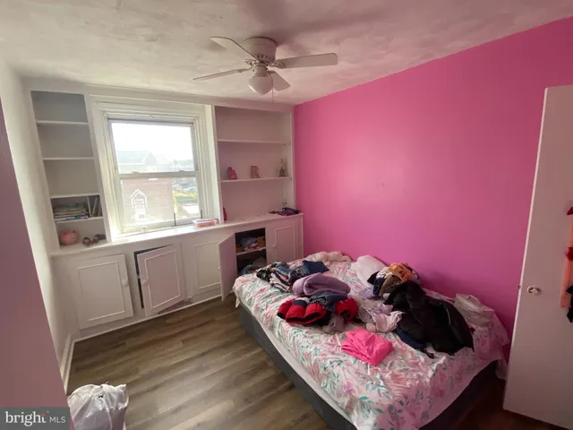 a bed room with a bed and a window