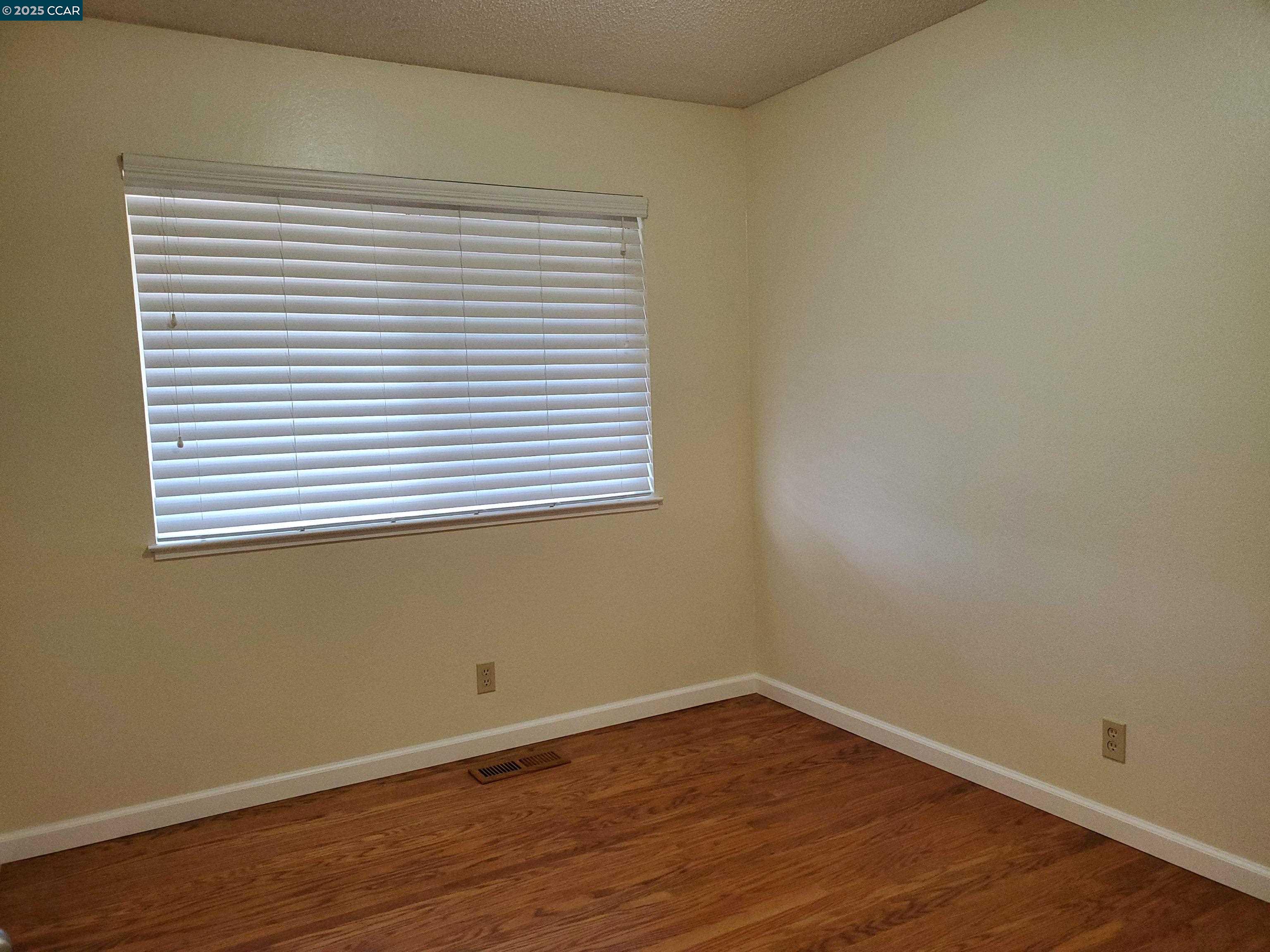 1616 Eve Drive Concord, CA 94521 - Photo 14 of 28 a view of a small space with wooden floor and a window