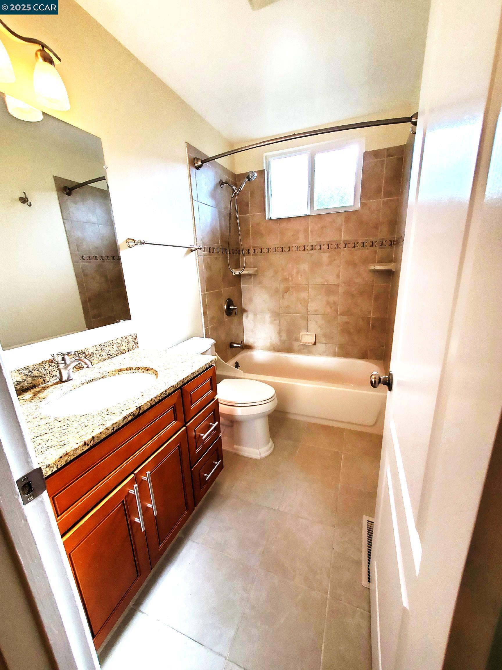 1616 Eve Drive Concord, CA 94521 - Photo 16 of 28 a bathroom with a sink a toilet and shower