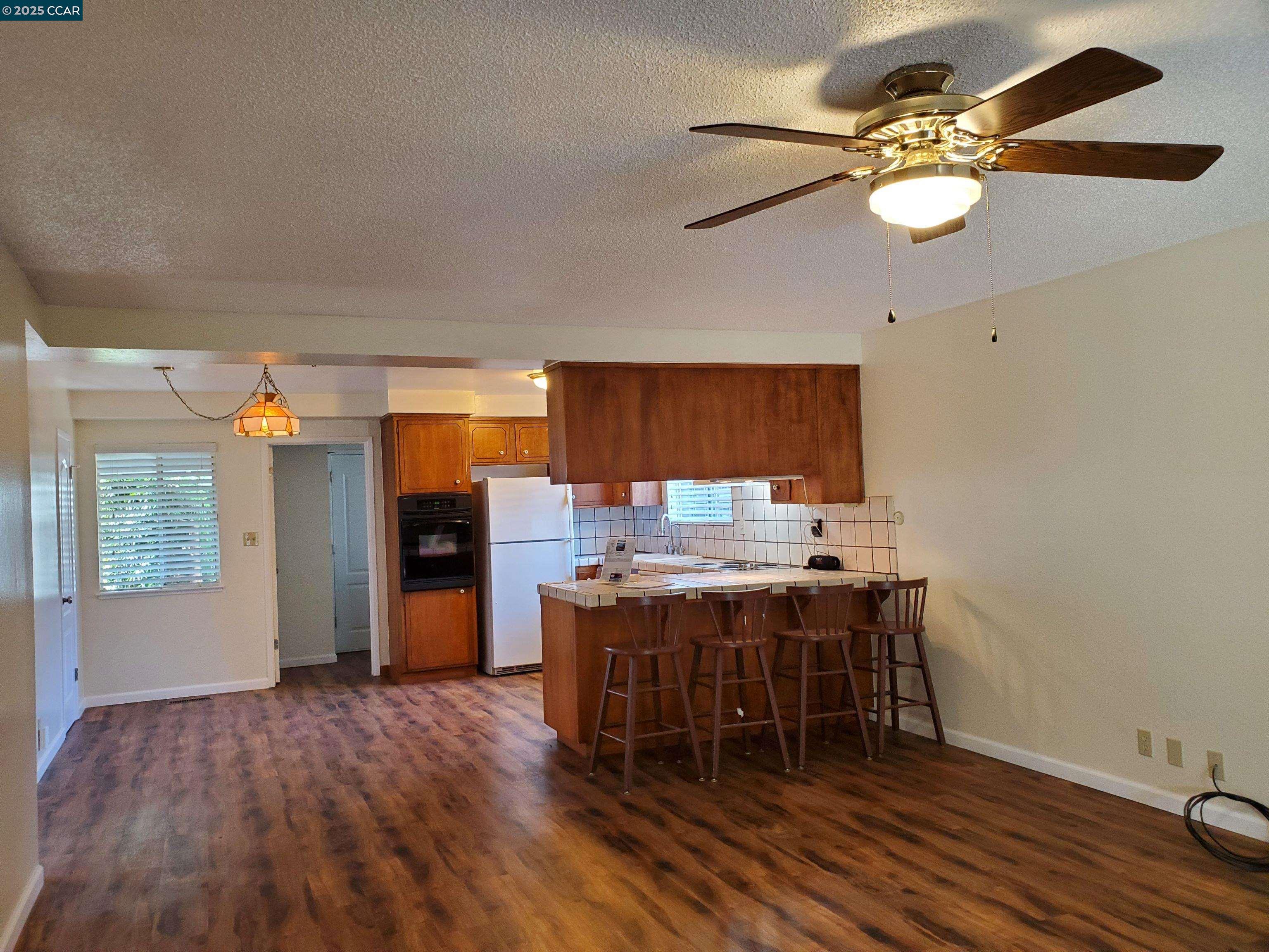 1616 Eve Drive Concord, CA 94521 - Photo 24 of 28 a view of a dining room with furniture and chandelier