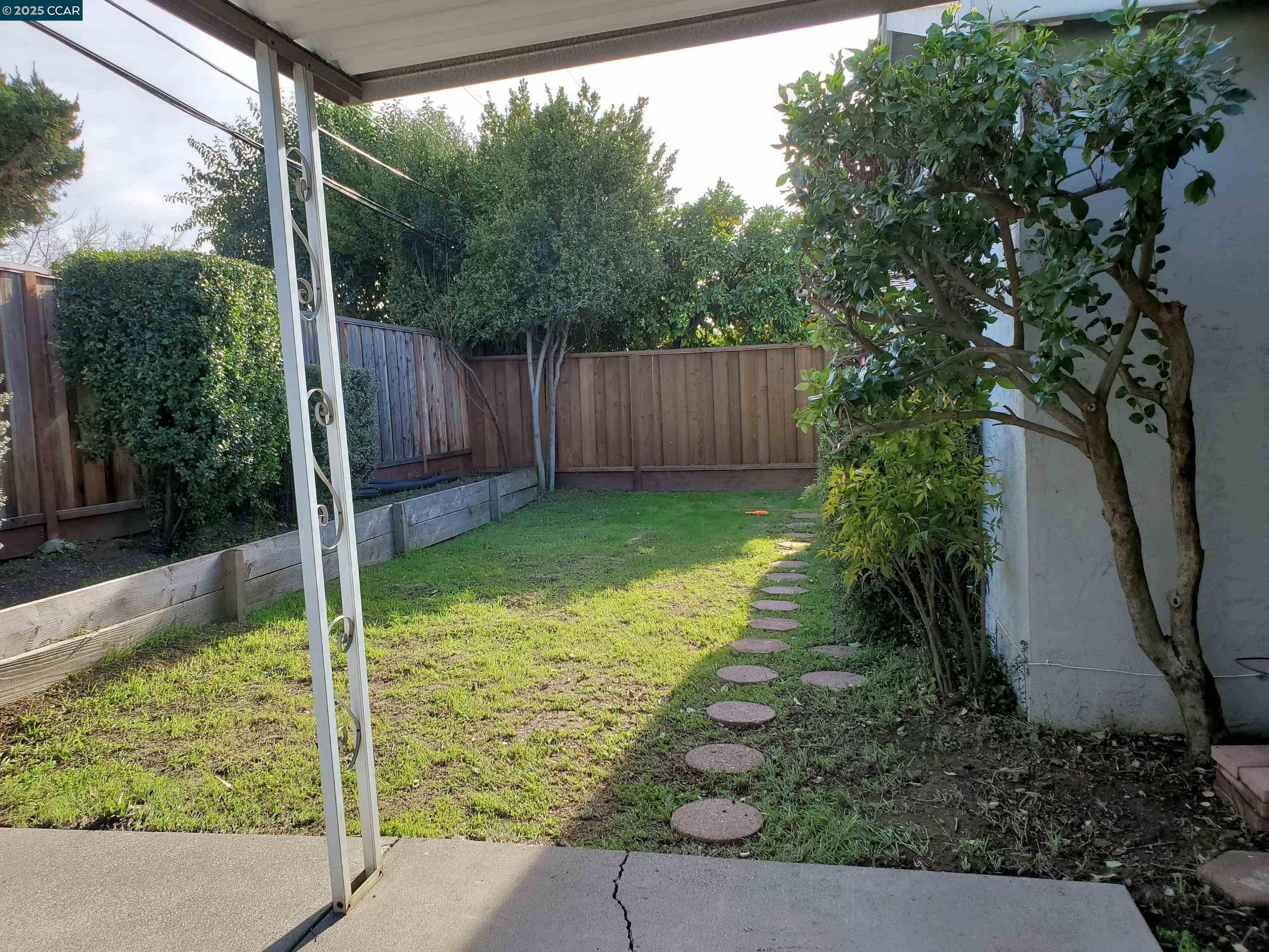 1616 Eve Drive Concord, CA 94521 - Photo 5 of 28 a view of a backyard with a small cabin