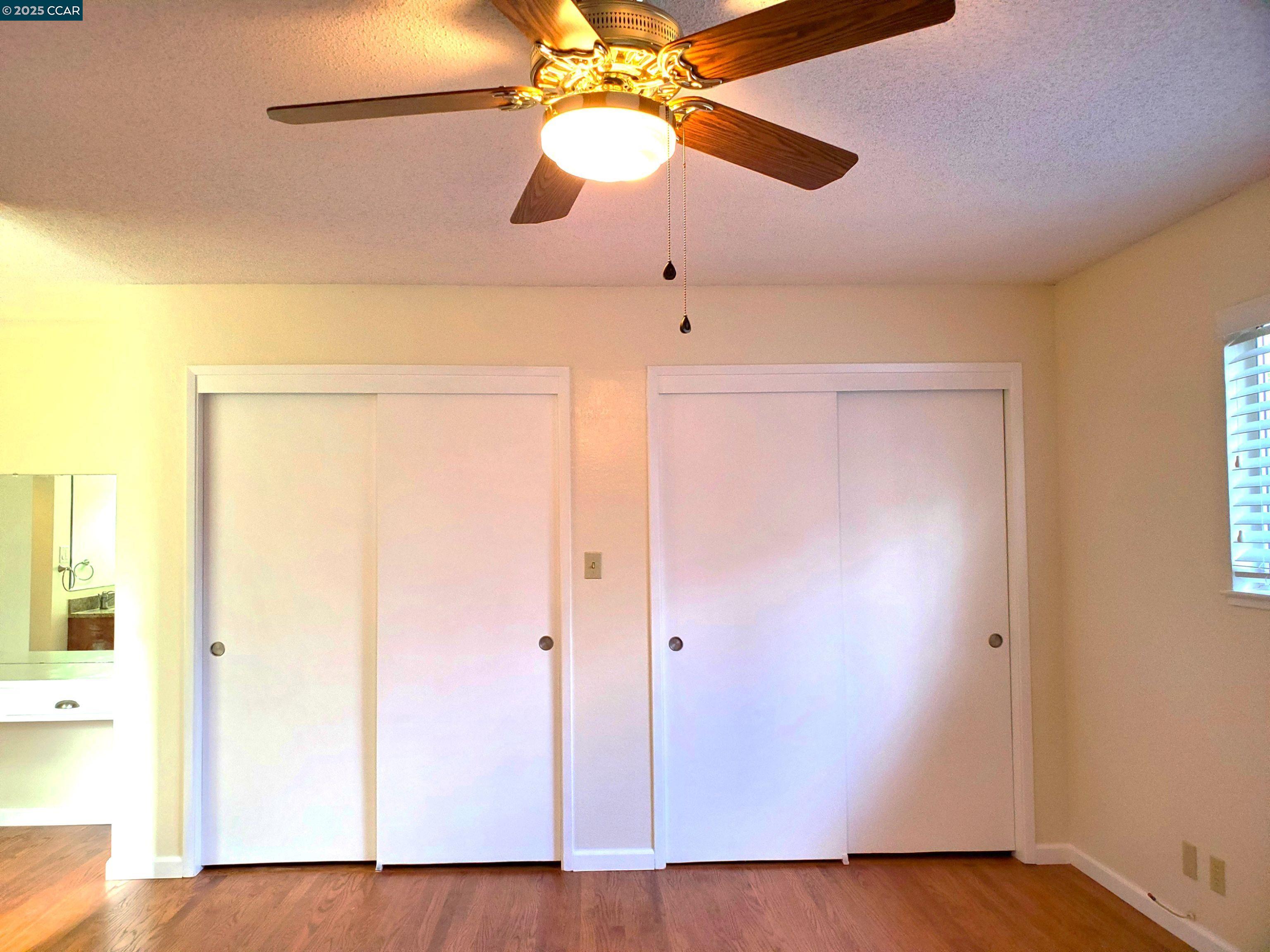 1616 Eve Drive Concord, CA 94521 - Photo 10 of 28 a view of a room with wooden floor