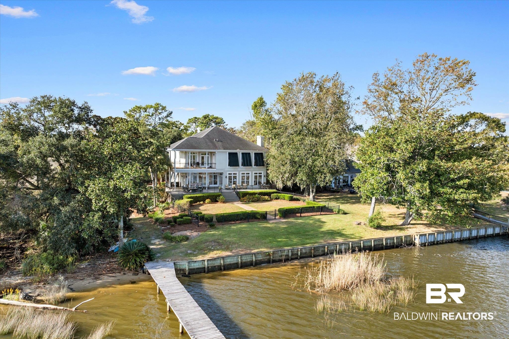 4930 River Trace Theodore, AL 36582 - Photo 2 of 57 Rear view of house featuring a water view and a yard