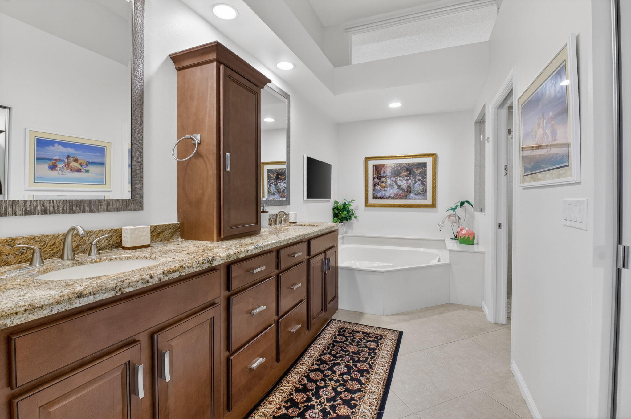 2462 Northwest 63rd Street Boca Raton, FL 33496 - Photo 18 of 41 a spacious bathroom with a granite countertop sink and mirror