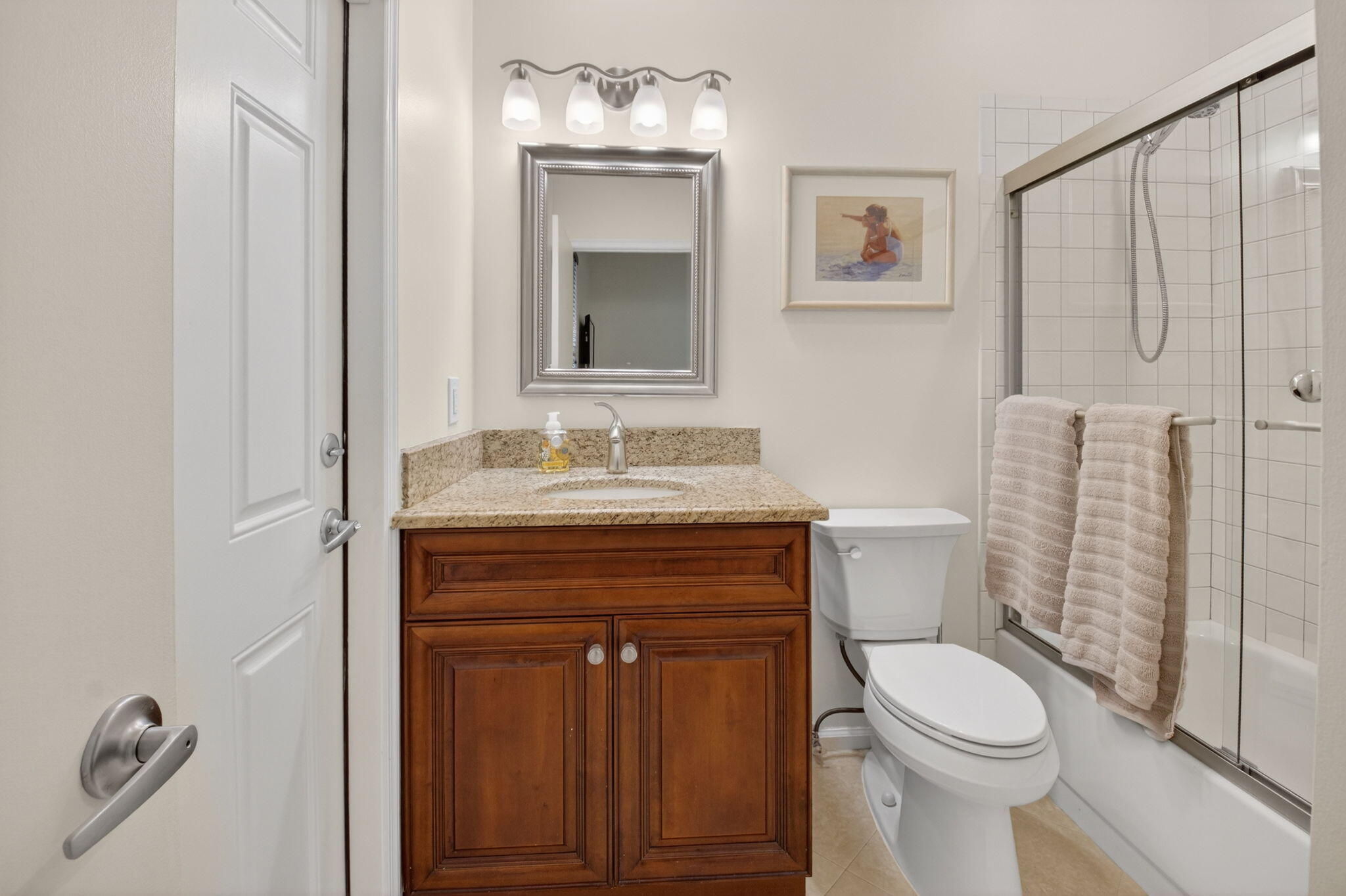 2462 Northwest 63rd Street Boca Raton, FL 33496 - Photo 21 of 41 a bathroom with a sink a toilet and shower