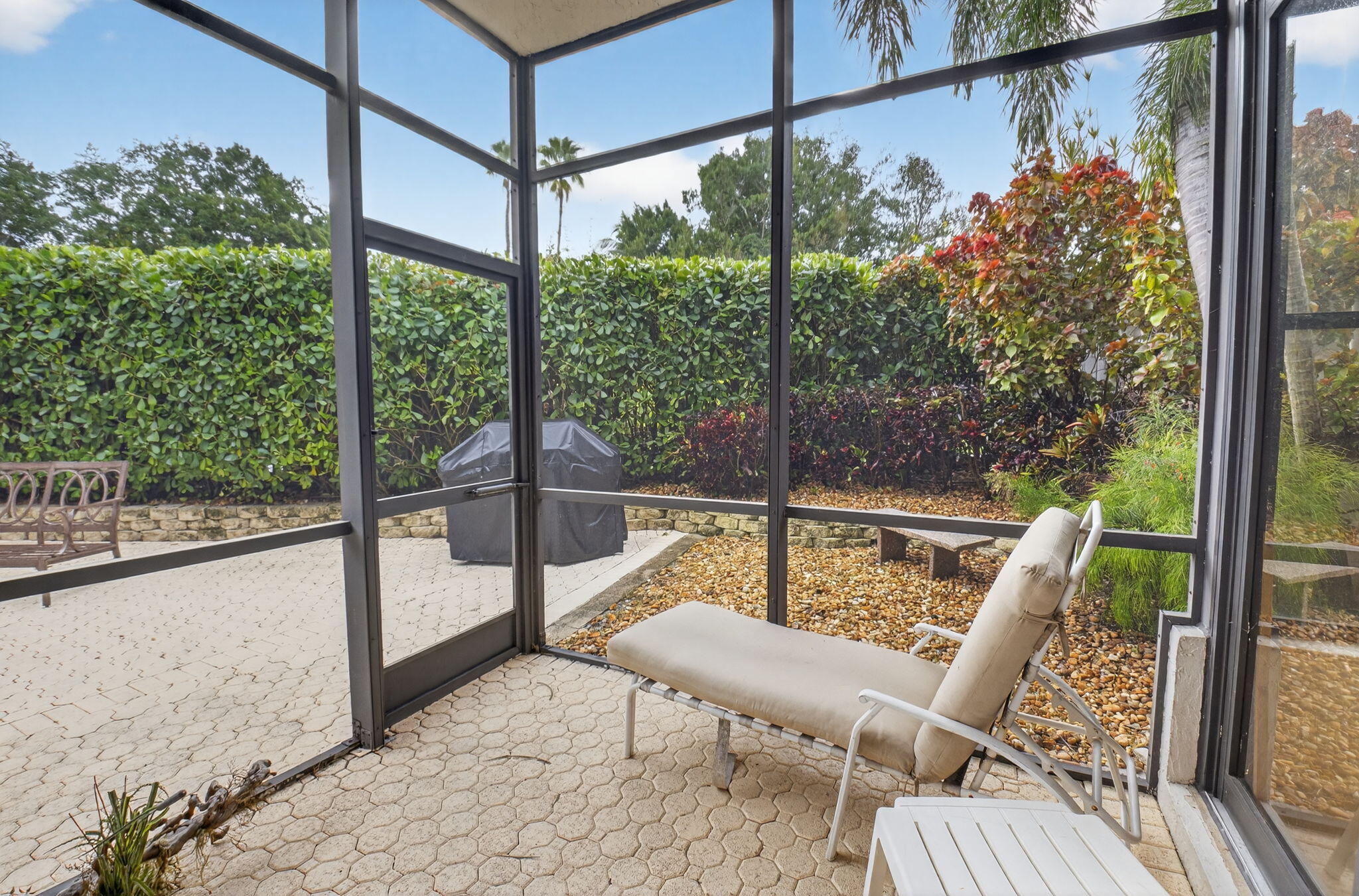 2462 Northwest 63rd Street Boca Raton, FL 33496 - Photo 24 of 41 a view of a chair and tables in the balcony