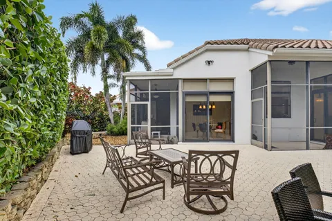 a view of a chairs and table in patio