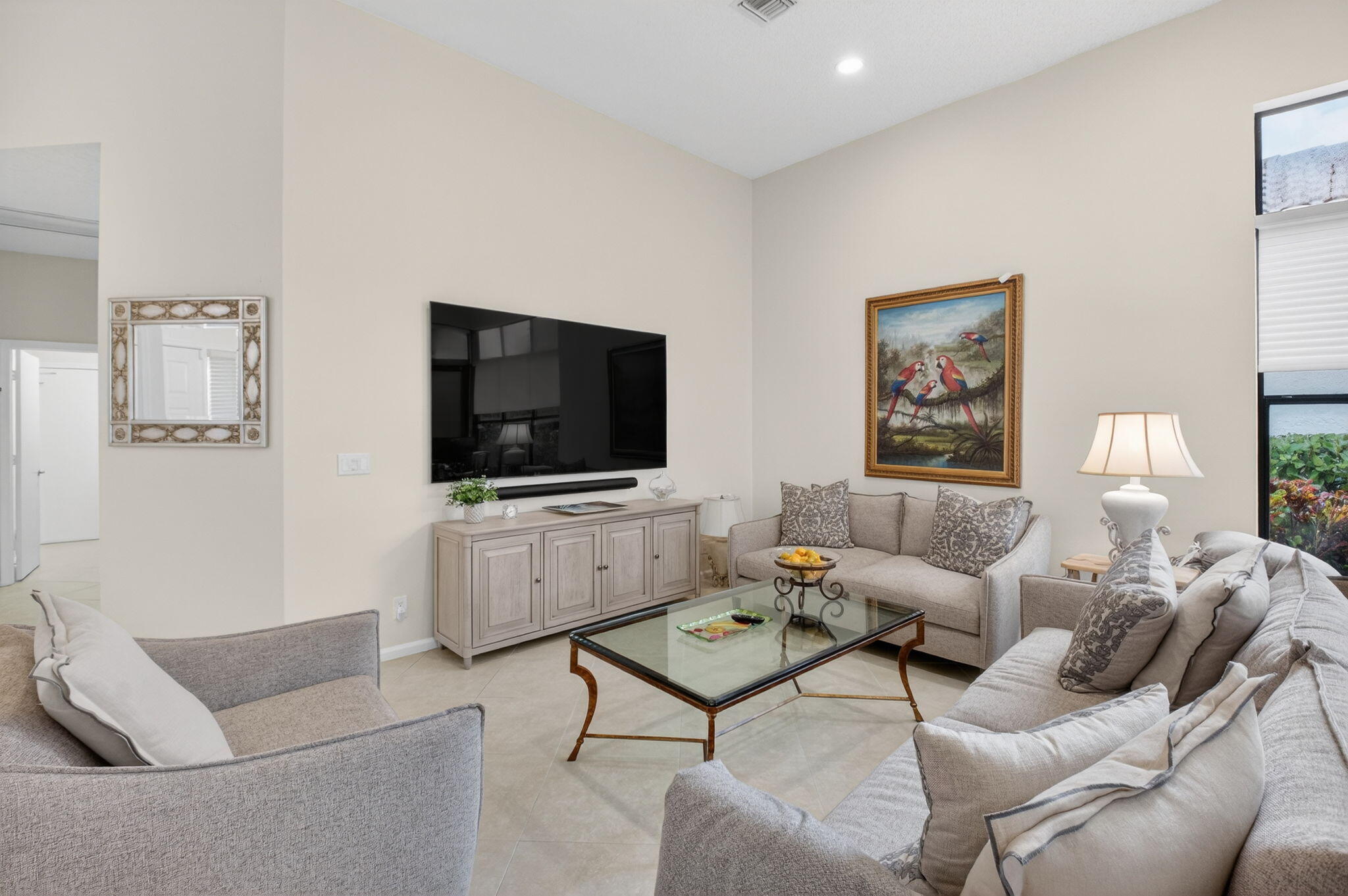 2462 Northwest 63rd Street Boca Raton, FL 33496 - Photo 5 of 41 a living room with furniture and a flat screen tv