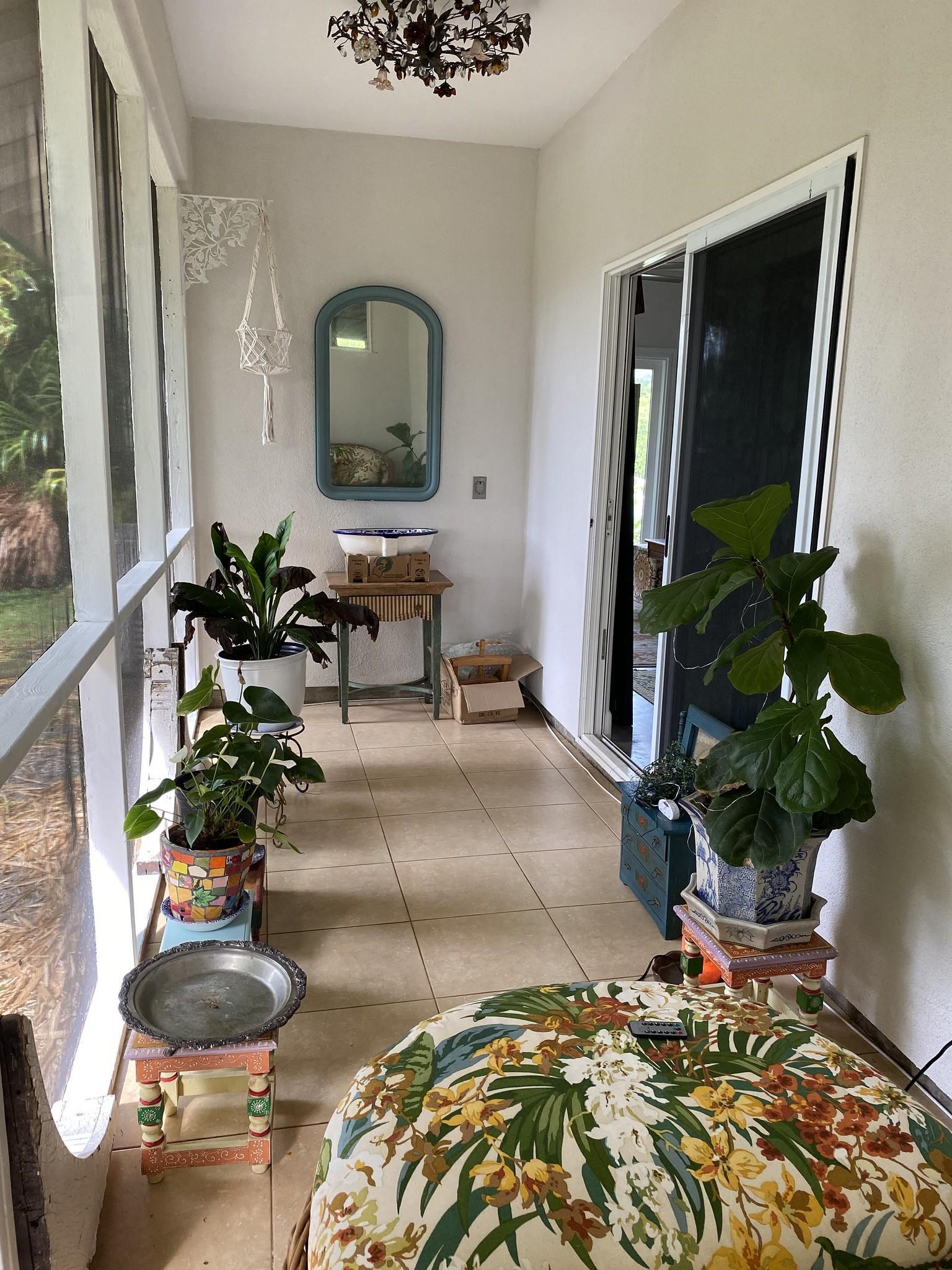 230 North Holokai Road, Unit B Haiku, HI 96708 - Photo 6 of 36 a living room with furniture and a potted plant