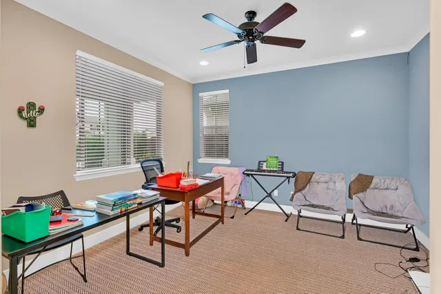 a bathroom with a granite countertop toilet sink and mirror
