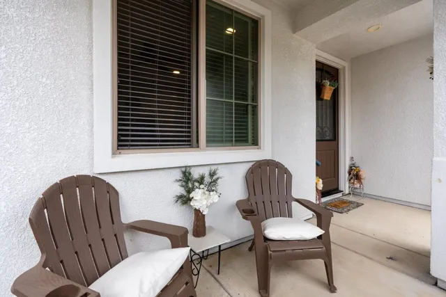 a living room with furniture and white walls
