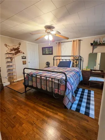 a view of living room with furniture and wooden floor