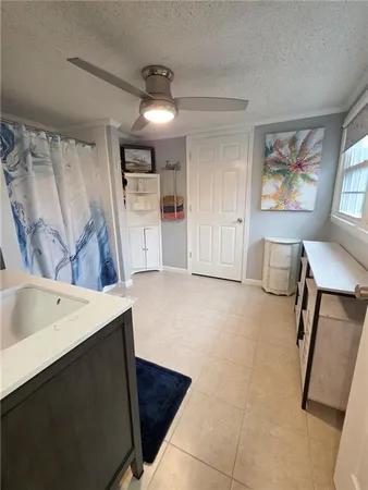 a bathroom with a sink vanity and mirror