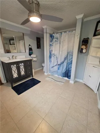 a bathroom with a toilet a sink and a mirror